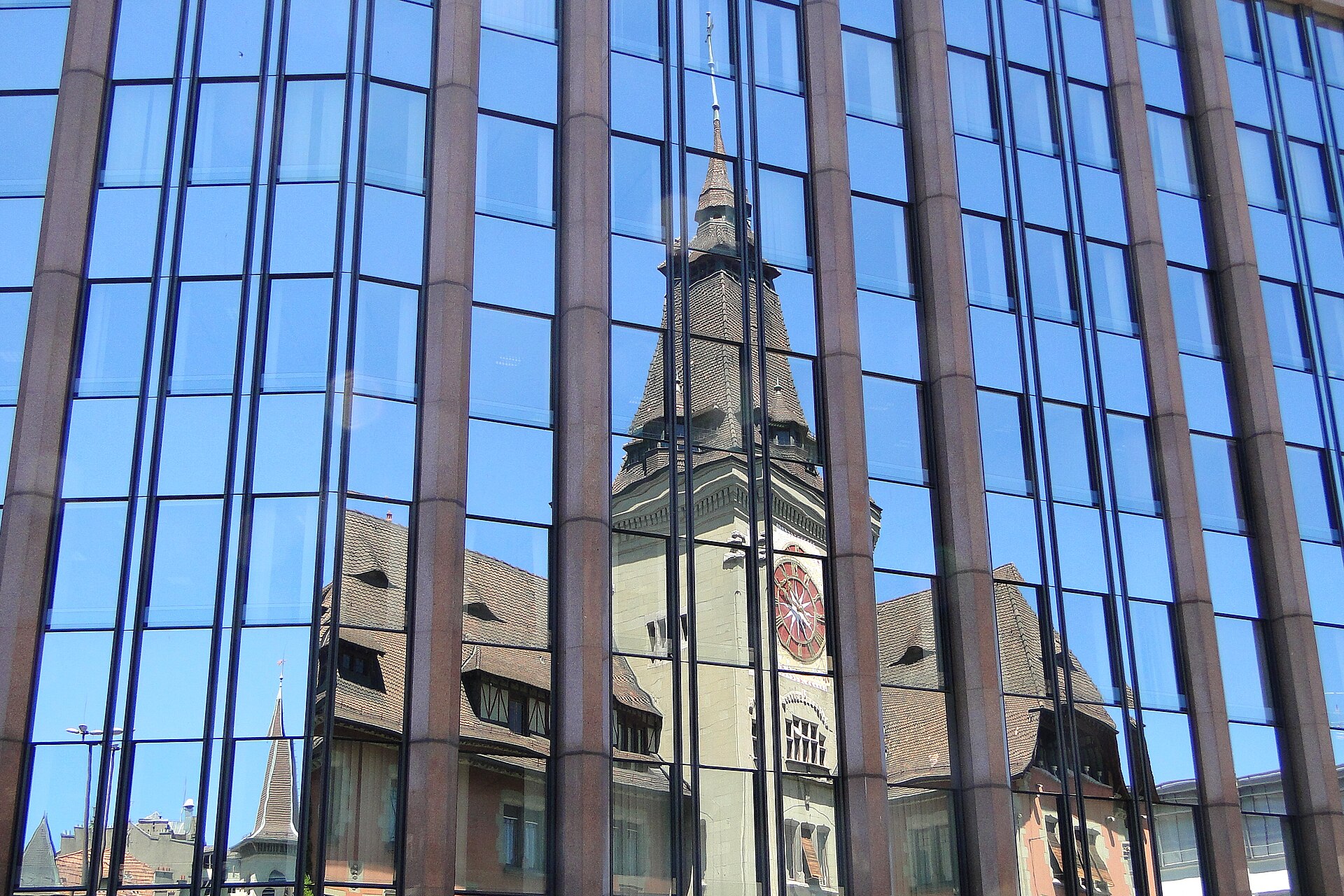 Glass facade representing a consistent organisational framework